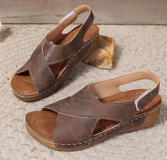 Roman platform sandals with decorative skirt and velcro closure in earth-tone colour