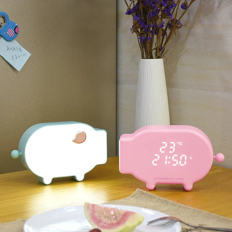 Blue LED alarm clock with USB charging port and temperature display on bedside table