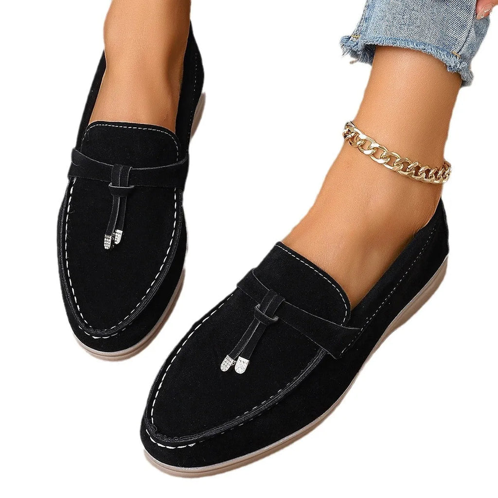Casual canvas slip-on loafers with a platform heel and round toe in black, apricot, and brown colour options.