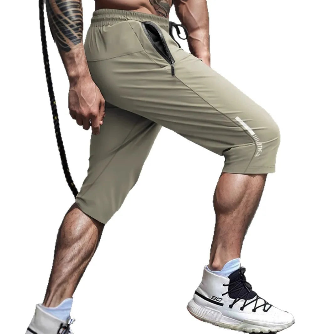 Men's straight-leg cropped sports pants in quick-dry nylon fabric, shown in khaki colour.