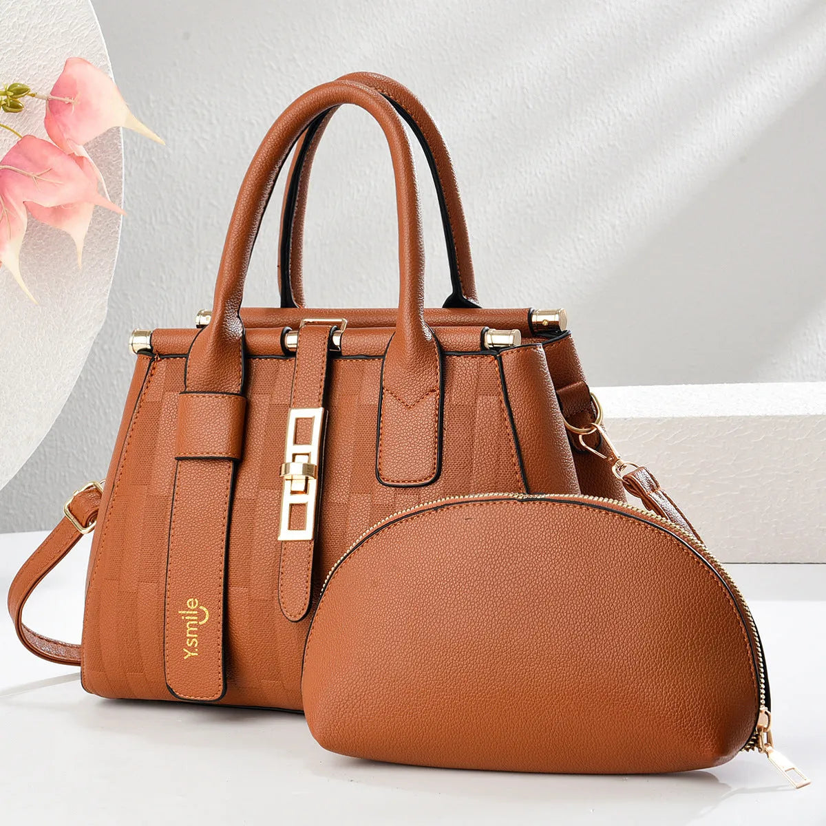 Round black PU leather crossbody bag with adjustable strap on a mannequin, showing zip closure.