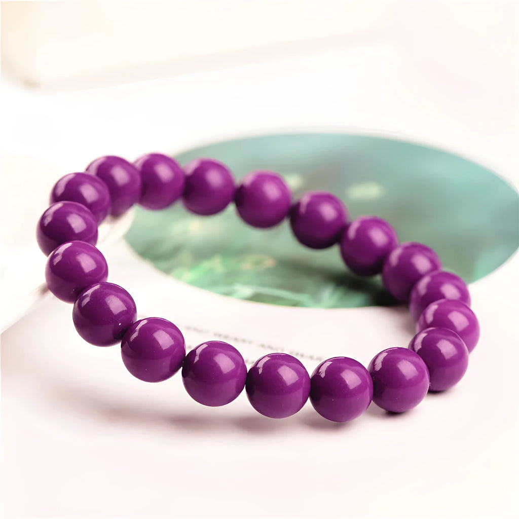 Genuine crystal bracelet with purple mica colour in a single circle design on a wrist.
