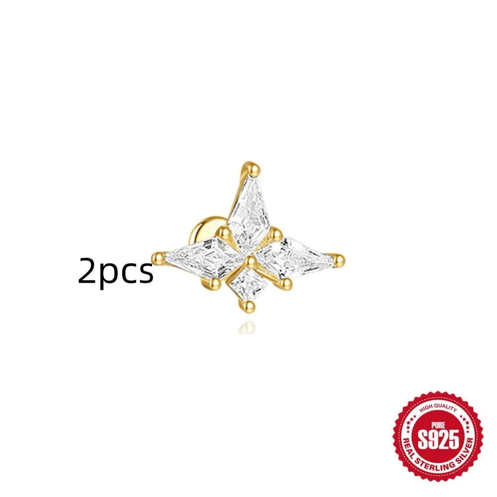 Geometric kite-shaped sterling silver earrings with a gold electroplated chain tassel featuring rhinestones.