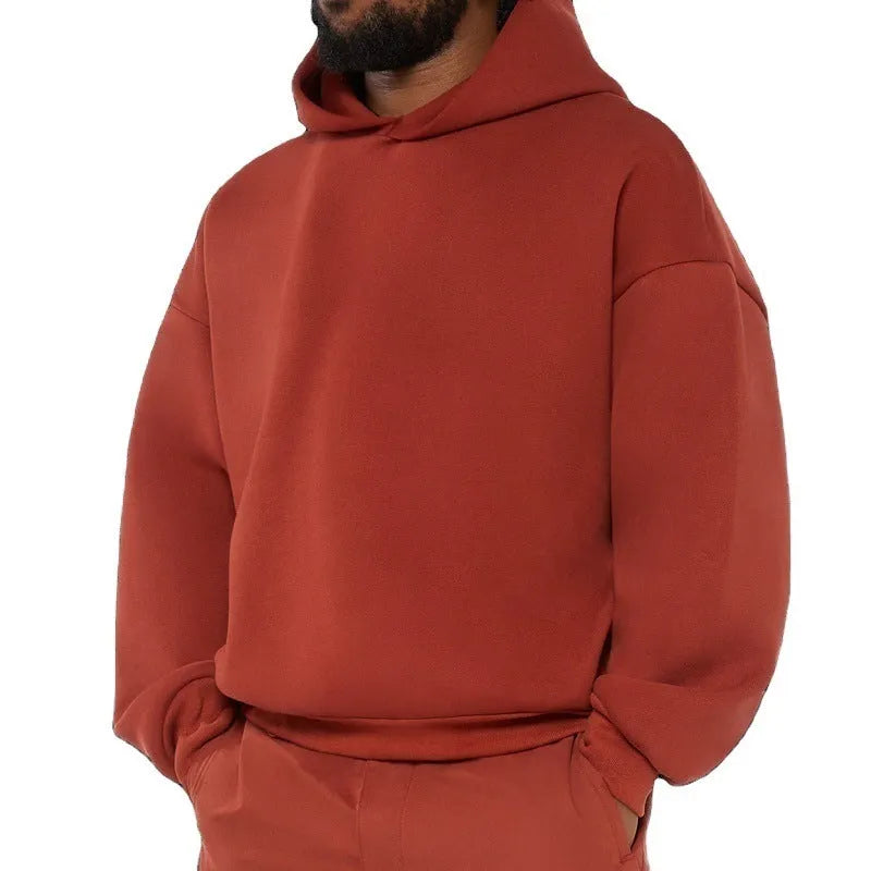 Men's grey fleece-lined cotton pullover hoodie with a front pocket and threaded long sleeves.