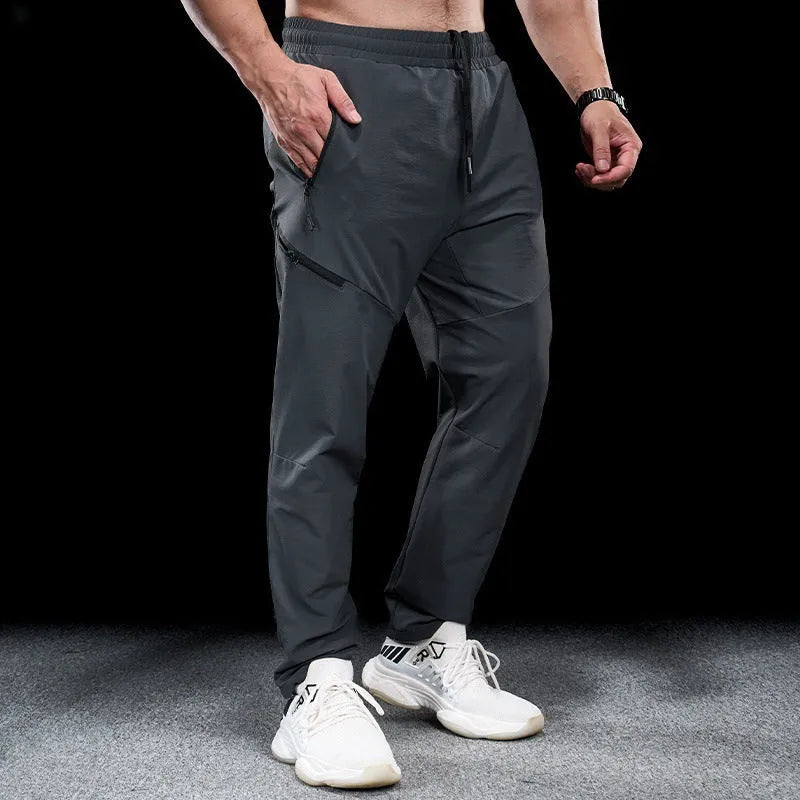 Men's waterproof quick-drying nylon workout trousers in Army Green colour showing mid waist design