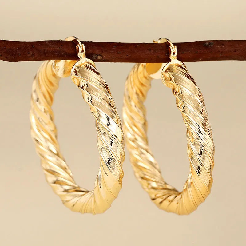 Women's geometric ring design ear clip earrings with drop-shaped elements and electroplated copper construction