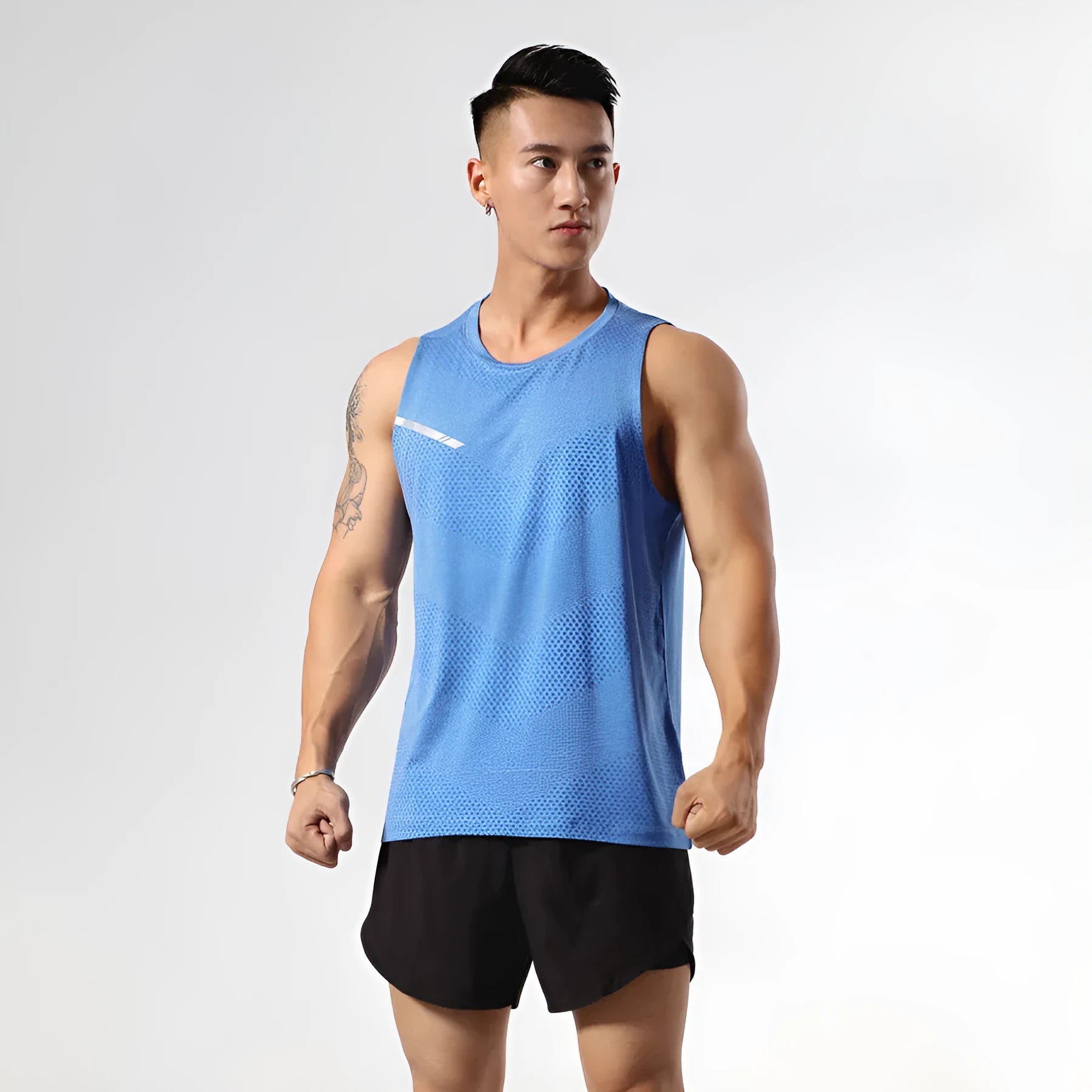 Solid colour quick-dry polyester sports tank top for men and women on a hanger.