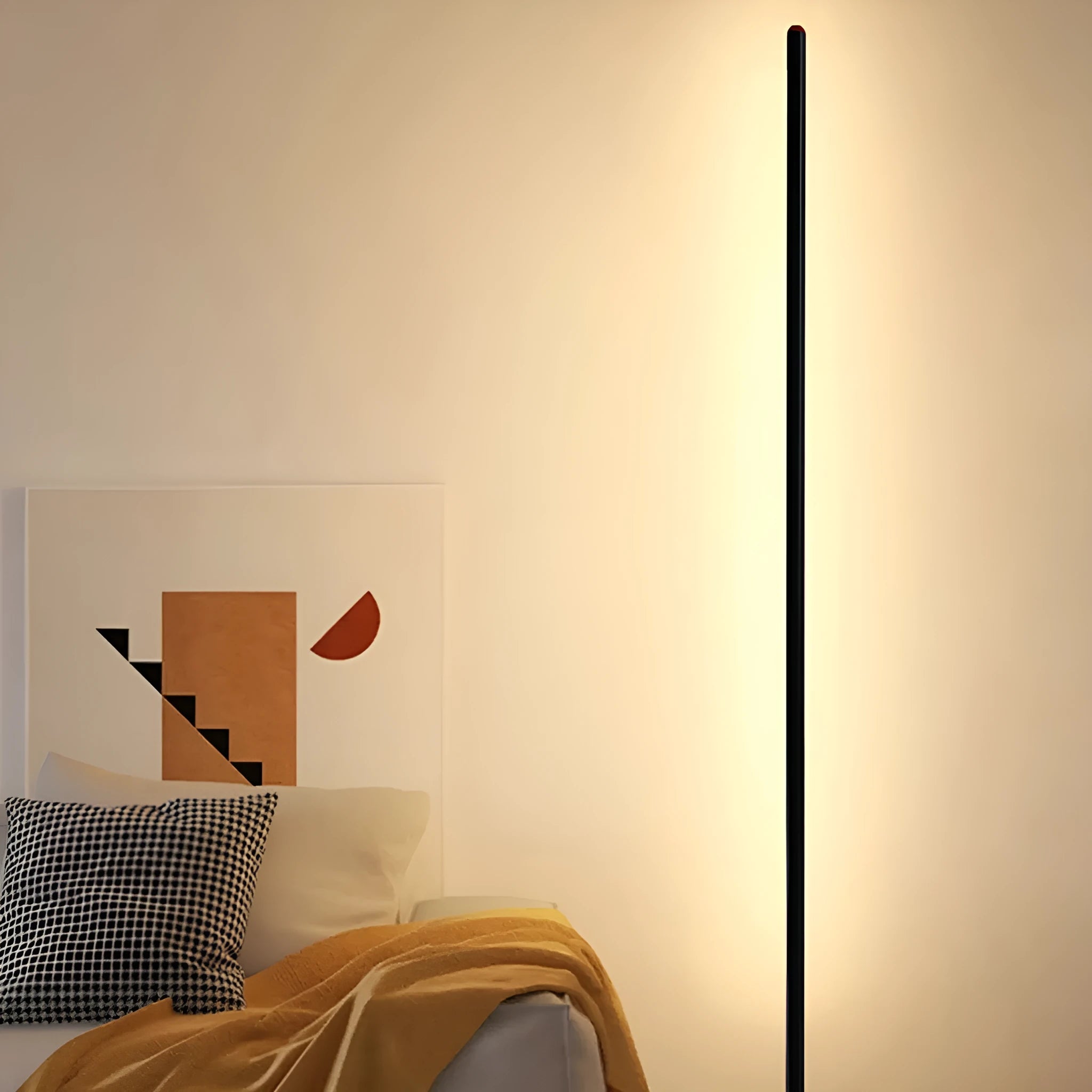 Vertical aluminium alloy floor lamp in modern simple style next to a sofa.