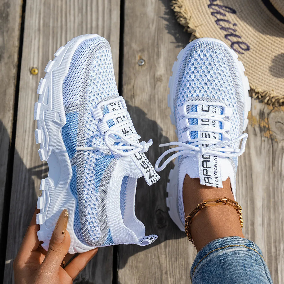 Women's Flyknit mesh lace-up sneakers in grey and white colourway