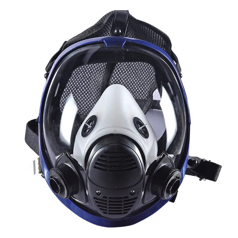 Gas mask with activated carbon canister and spherical silicone facepiece showing trapezoidal filter design