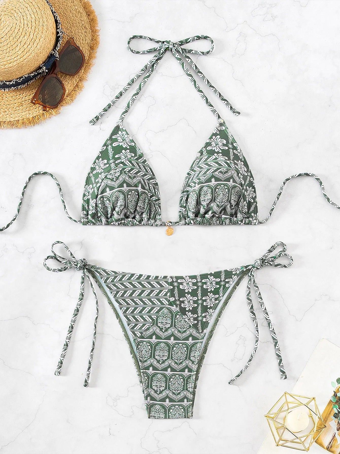 Adult female green polyester bandage swimsuit with split bikini top and briefs.