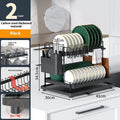 White and black double-layer kitchen storage rack with removable draining section for utensils.