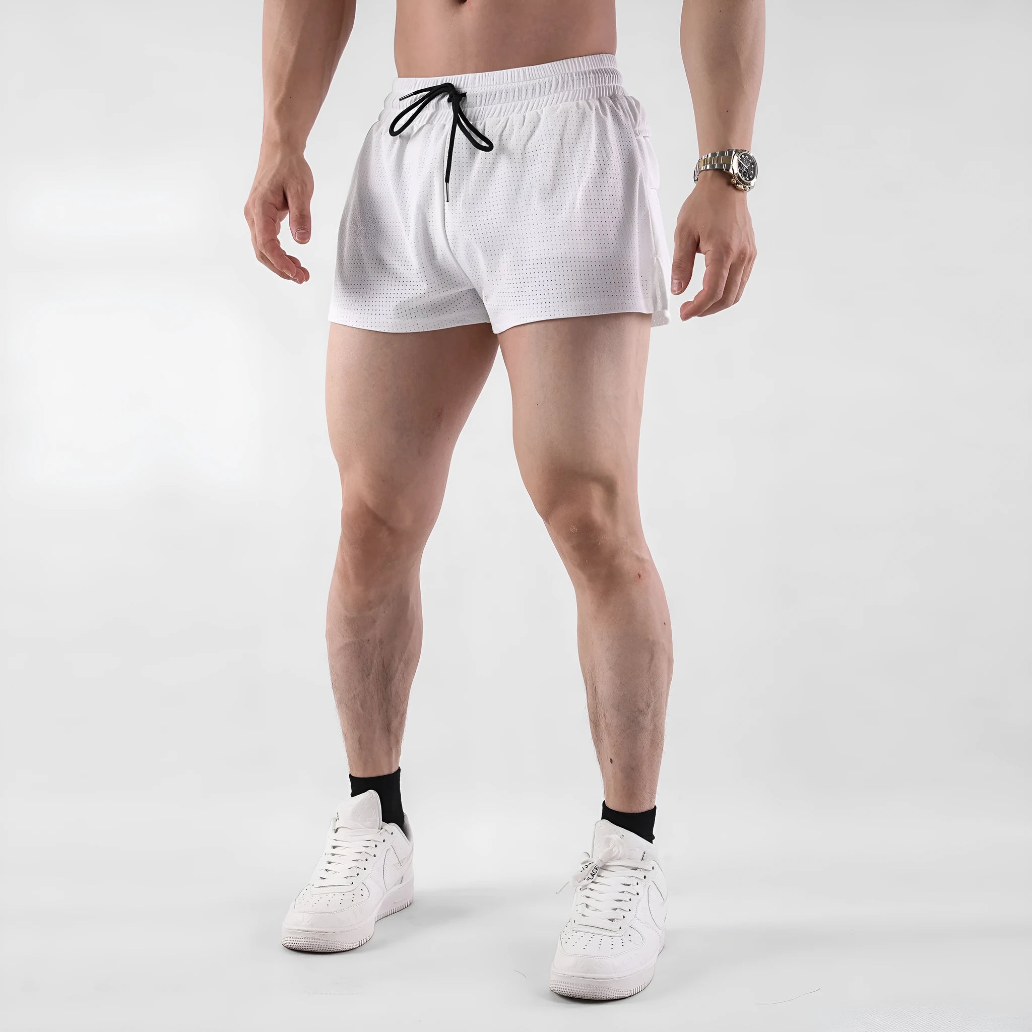 Men's black nylon quick-drying summer shorts laid flat, showing mid-waist and shorts length design.