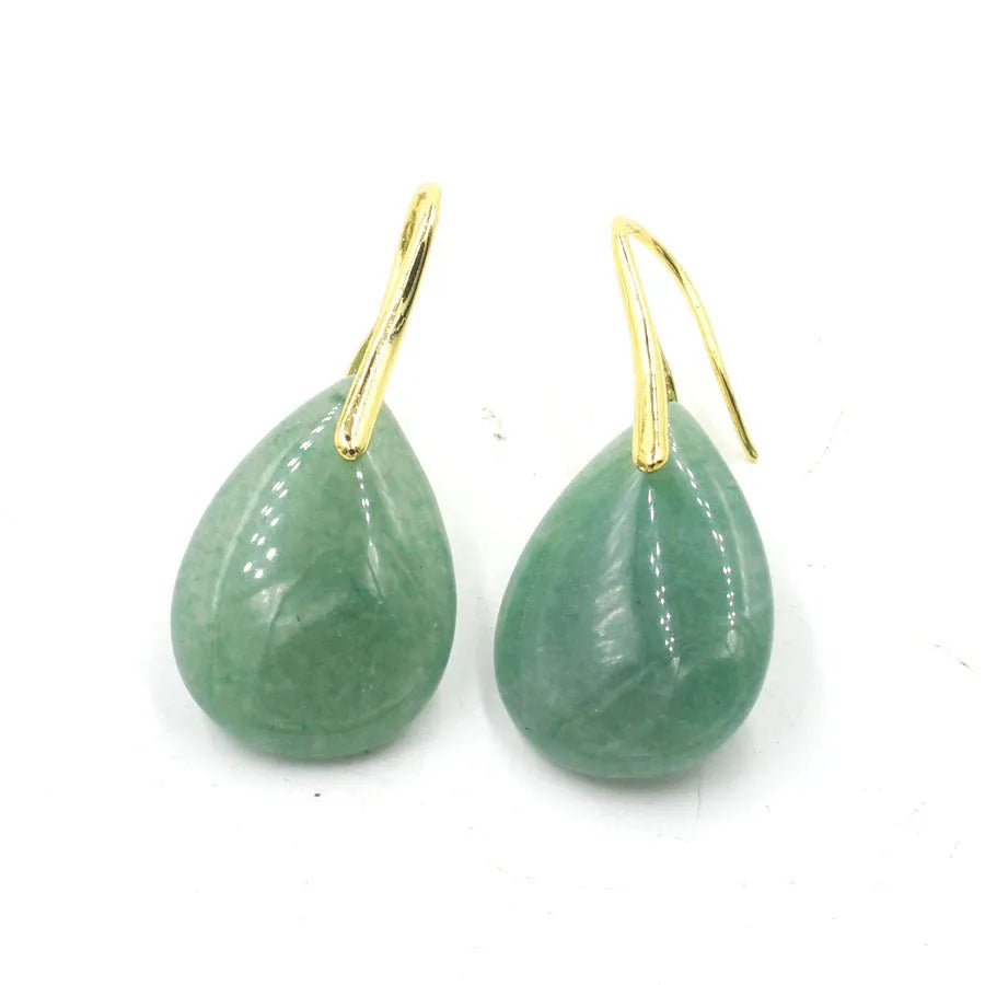 A pair of geometric water drop earrings made from crystal in one of nine colours, with an electroplated metal setting.
