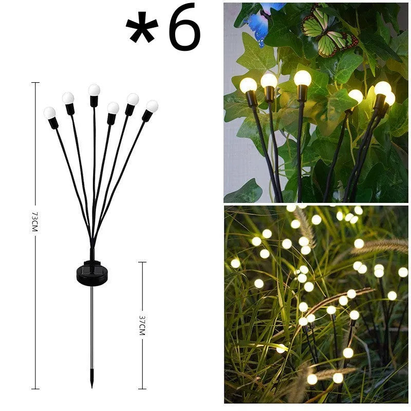 Solar-powered LED ground spike garden light with multiple heads and stainless steel soil plug.
