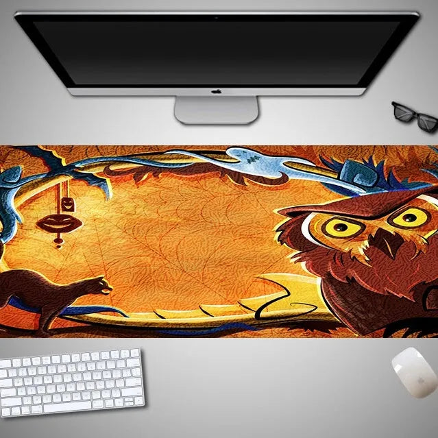 Large Halloween-themed computer mouse pad with graphic design on a desk