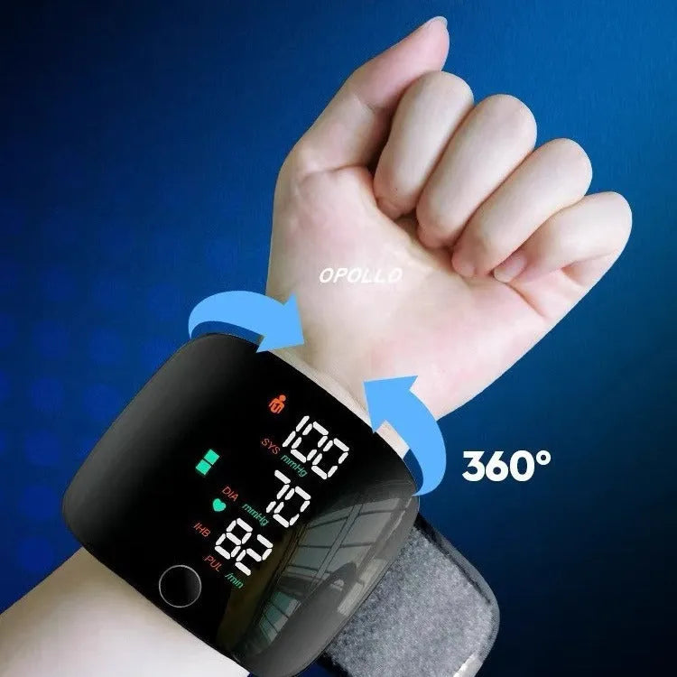 Black digital wrist blood pressure monitor with USB recharge port and display