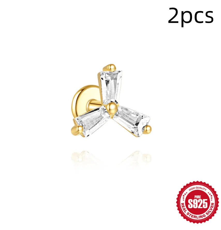 S925 sterling silver geometric stud earrings with inlaid zircon in golden clover, crown, and chain designs.