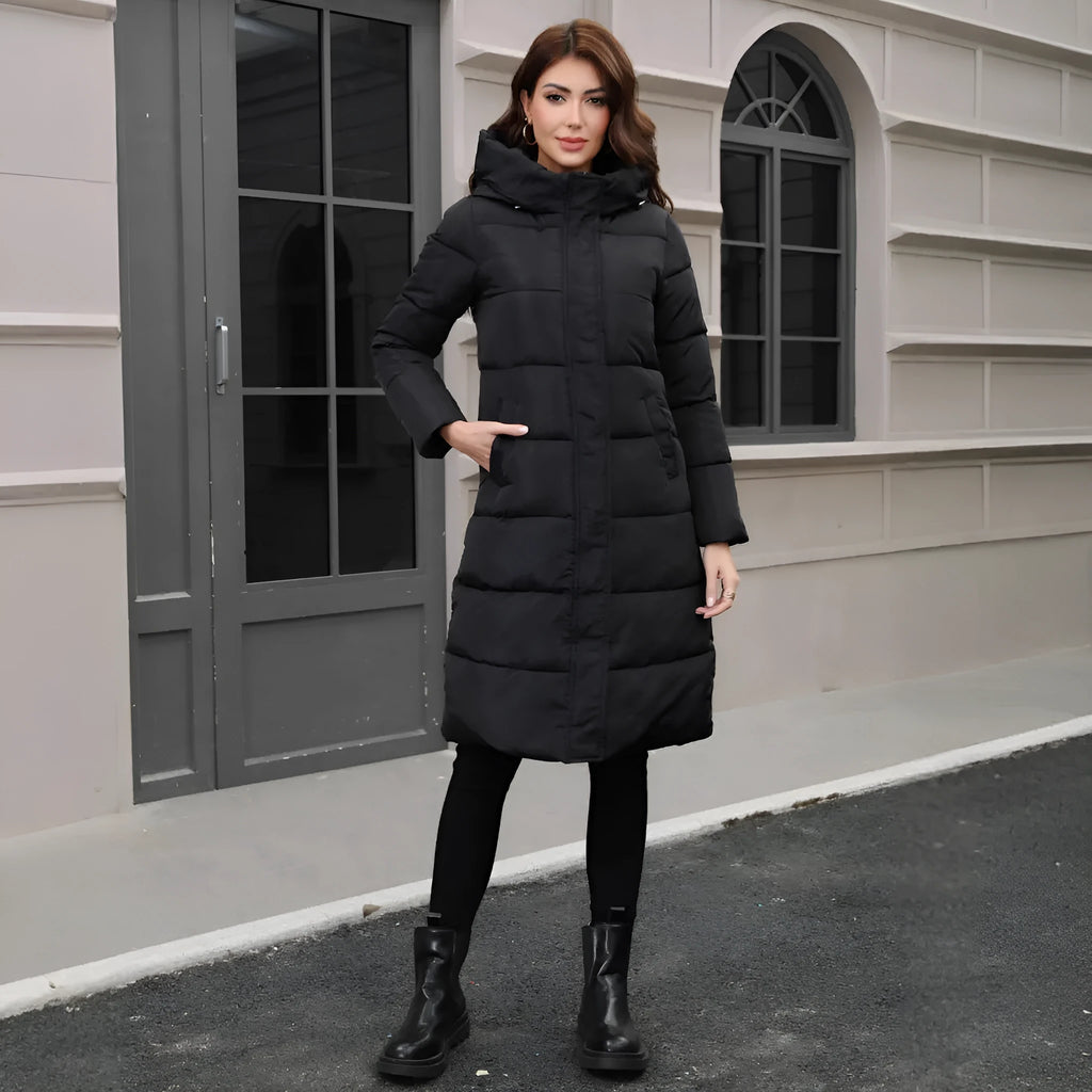 A black hooded slim-fit long jacket for men on a hanger.