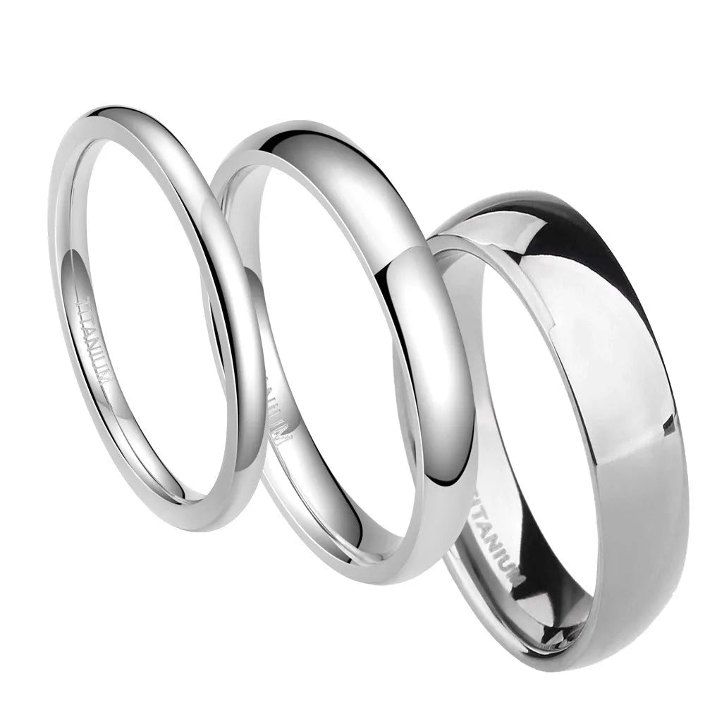 Silver titanium steel band ring shown in three widths: slim 2mm, standard 4mm, and wide 6mm on a plain background.