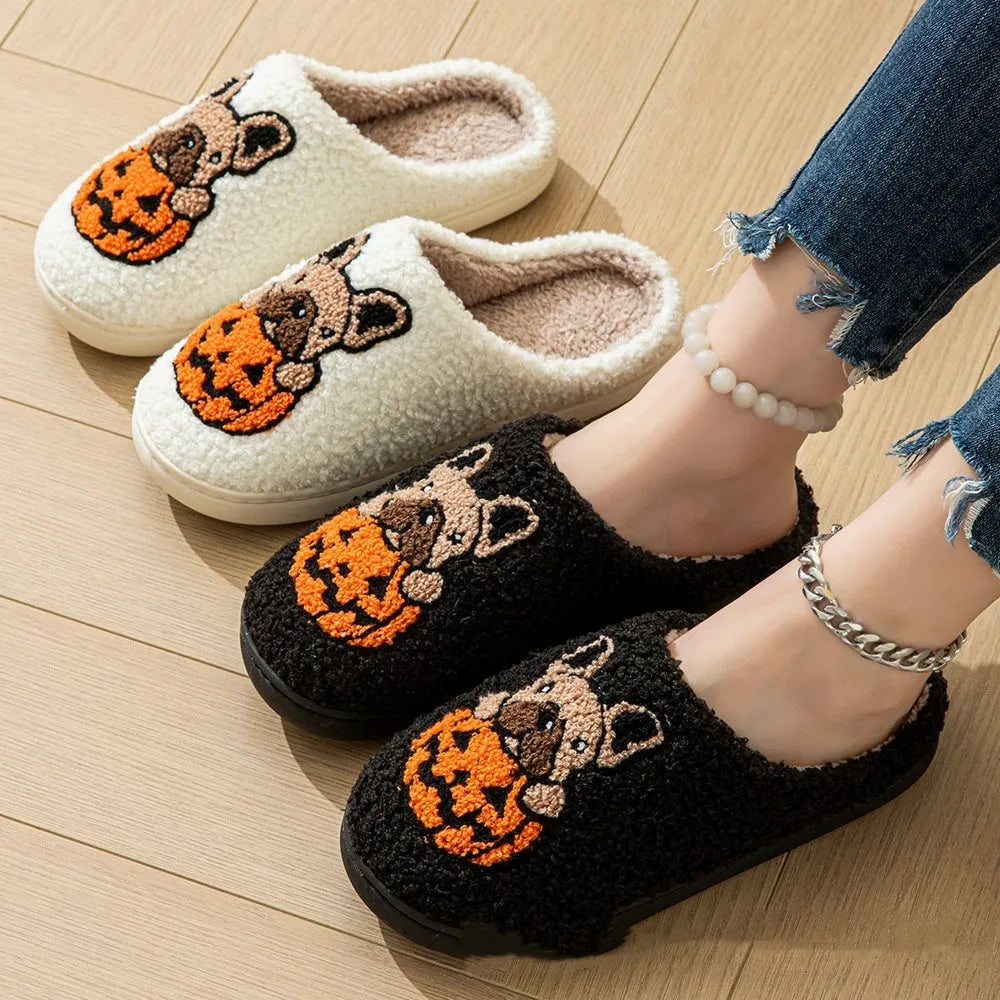 Black and white Halloween slippers with pumpkin patterns and plush fabric construction