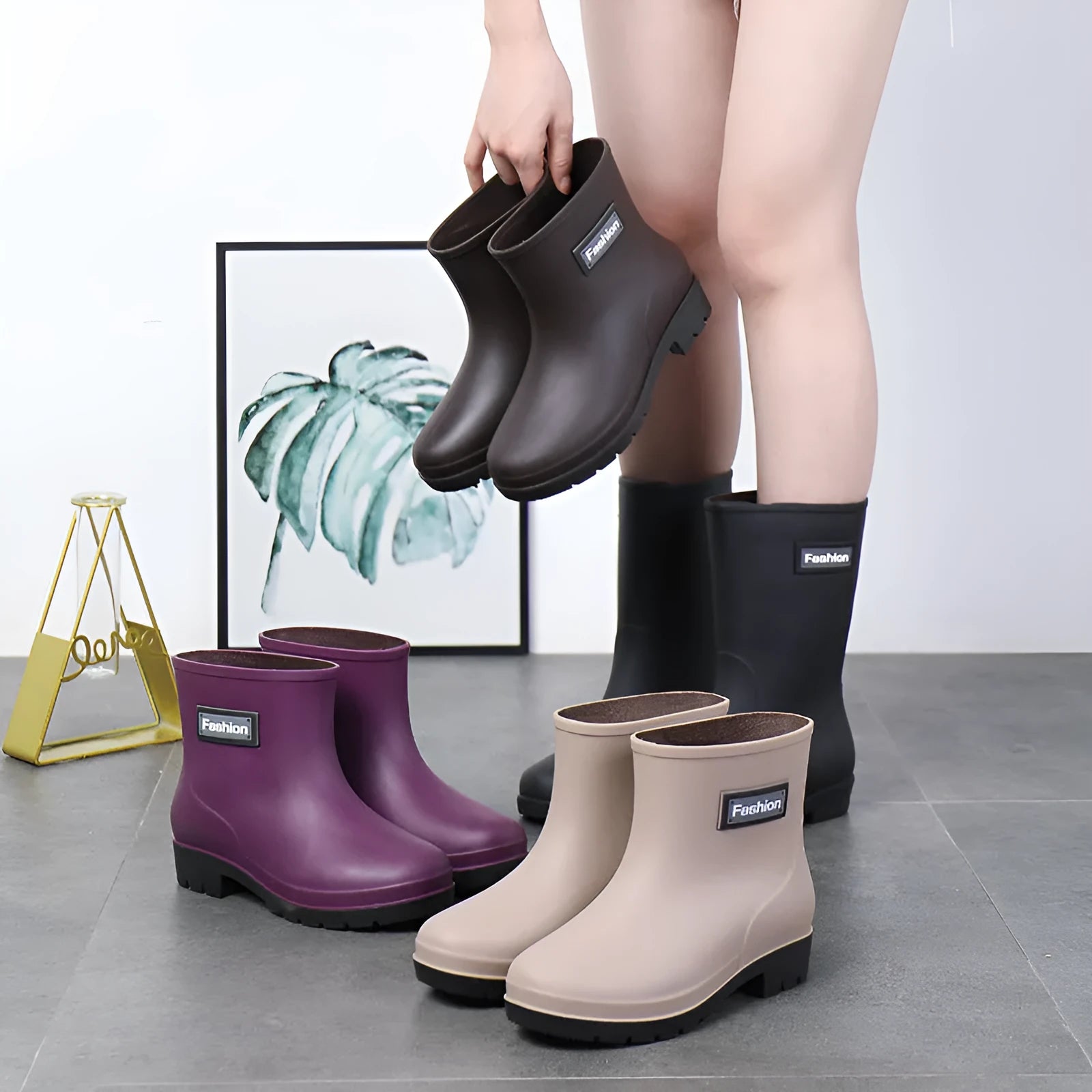 Women's mid-calf PVC rain boot in black, shown with a low heel and optional wool lining.