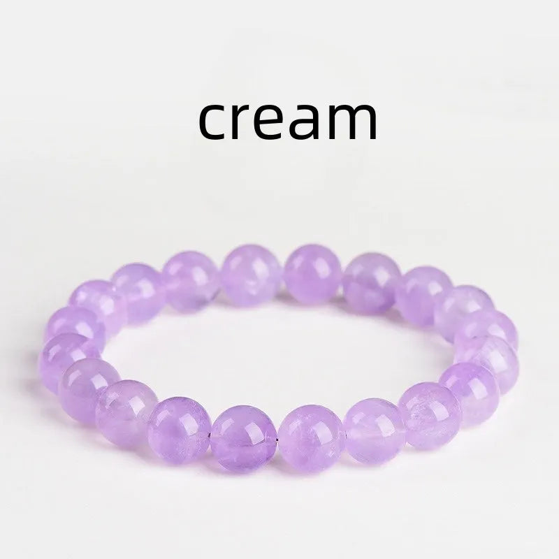 Lavender round amethyst bead bracelet with water ripple design on a cream body and transparent lavender beads.