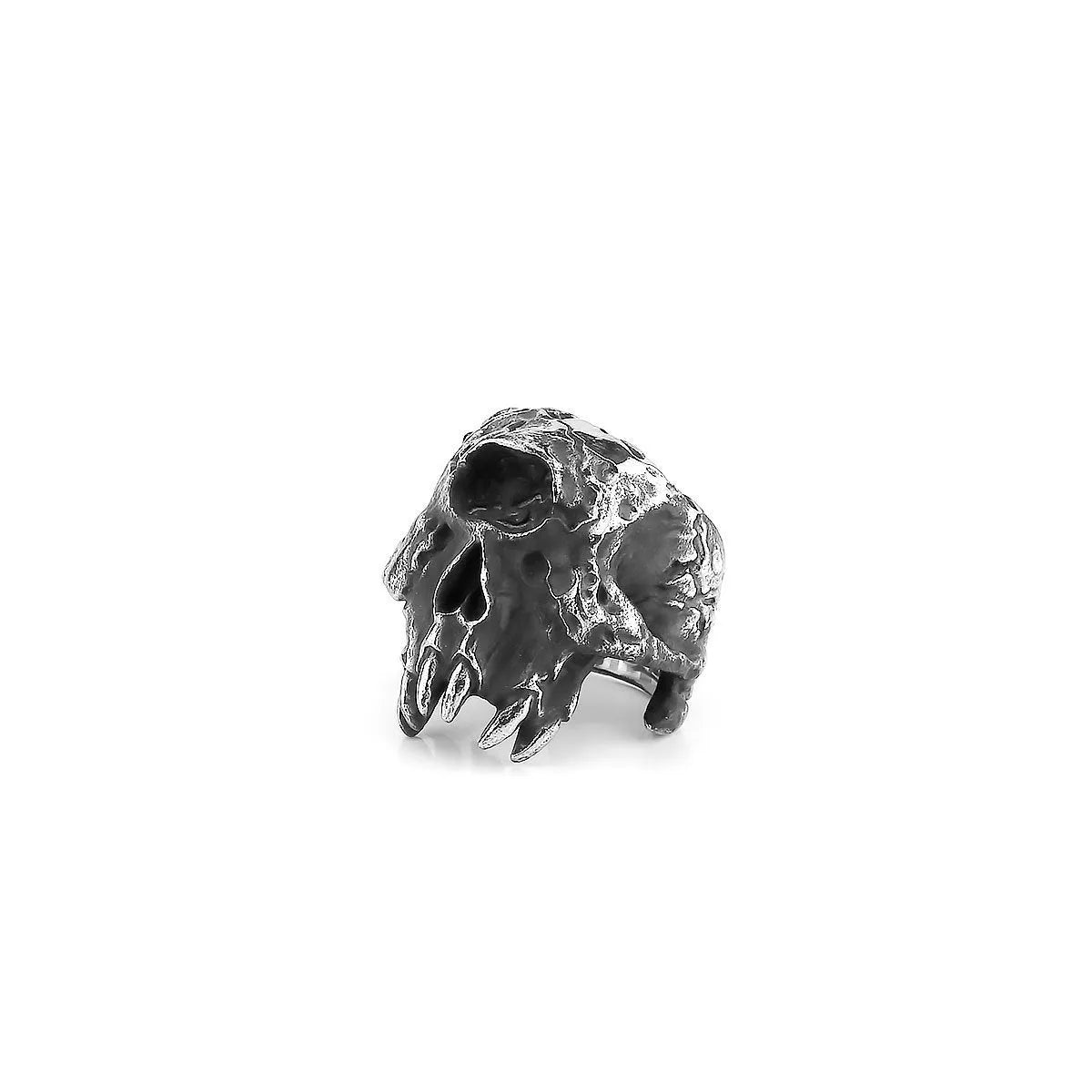 Close-up of a silver-toned alloy ring with a detailed one-eyed skull design on the finger.