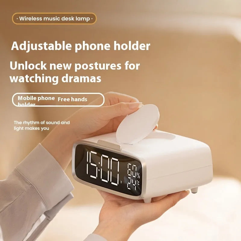 White wireless charger Bluetooth speaker alarm clock with LED night light on bedside table