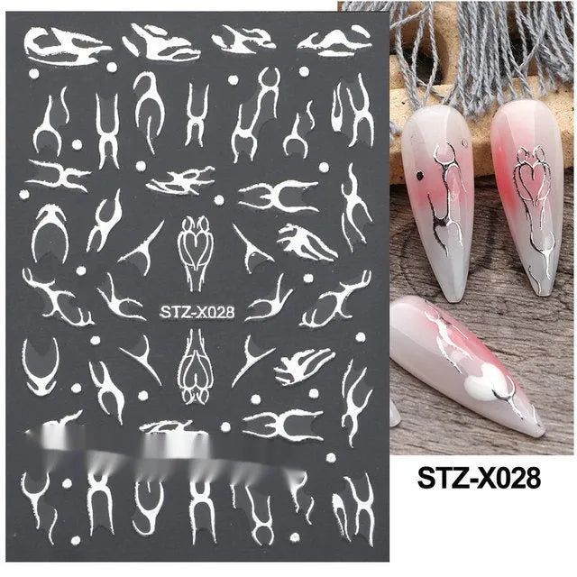 Sheet of black and silver love heart pattern nail art stickers with a plastic nail patch.
