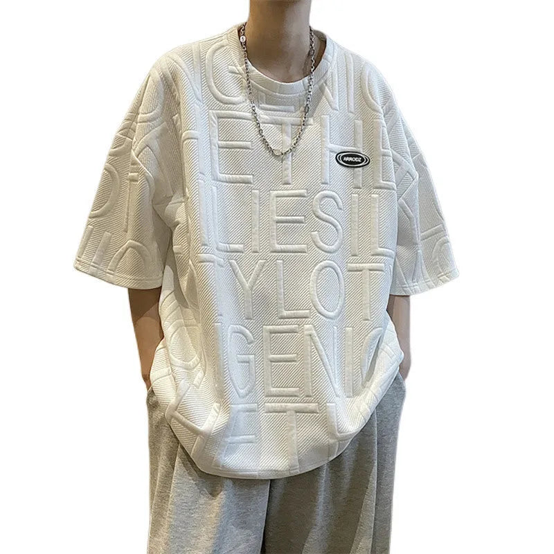 Men's grey short sleeve t-shirt with a raised white 3D letter pattern on the chest