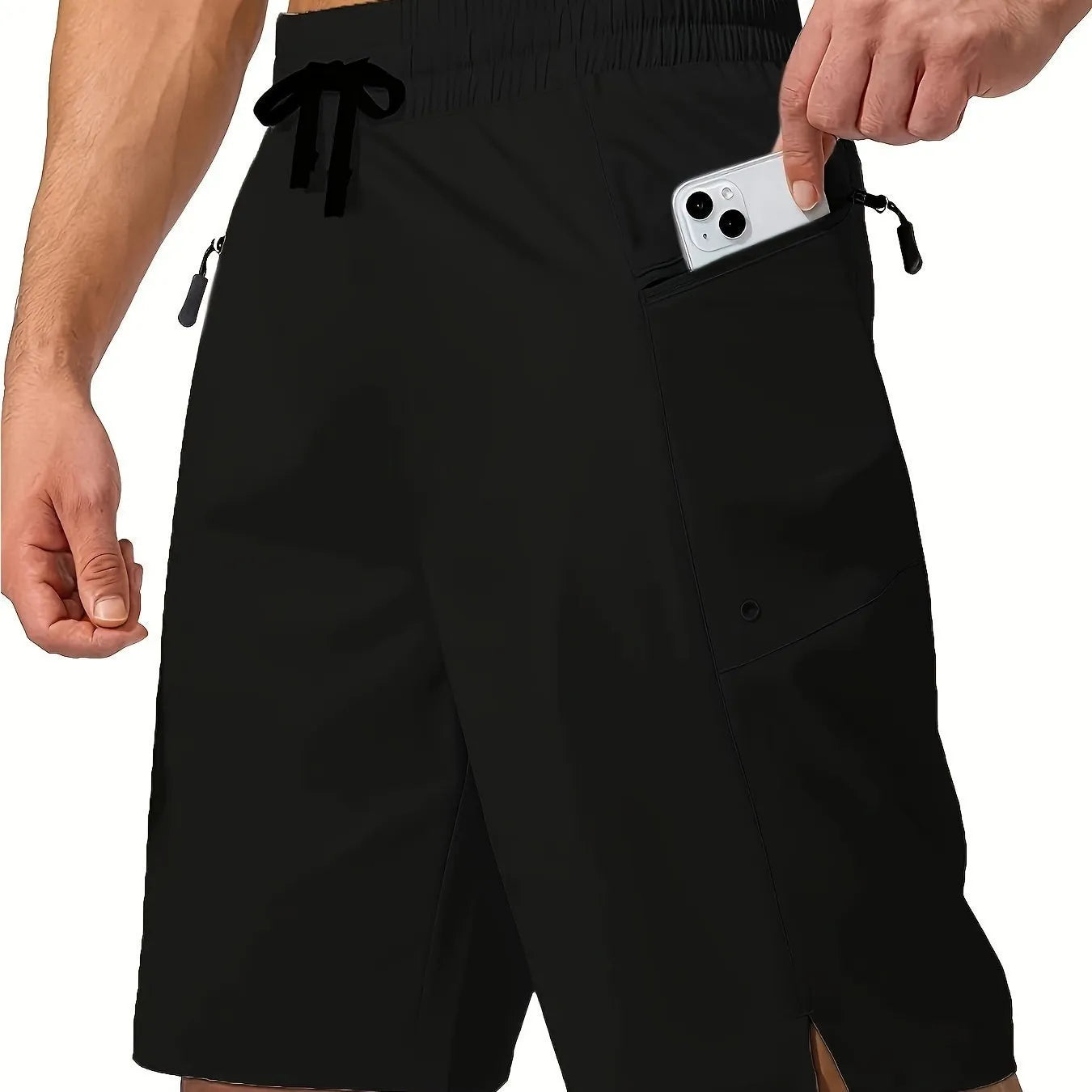 Man wearing solid colour quick-drying polyester beach shorts in a straight leg fit.
