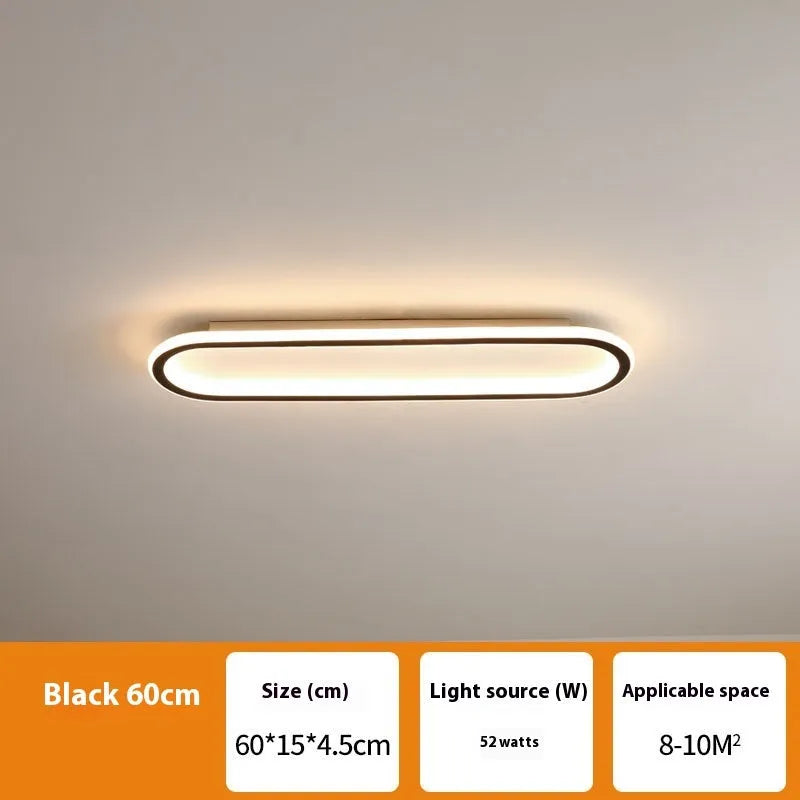 Minimalist black aluminium strip ceiling lamp with PVC shade mounted on a white ceiling