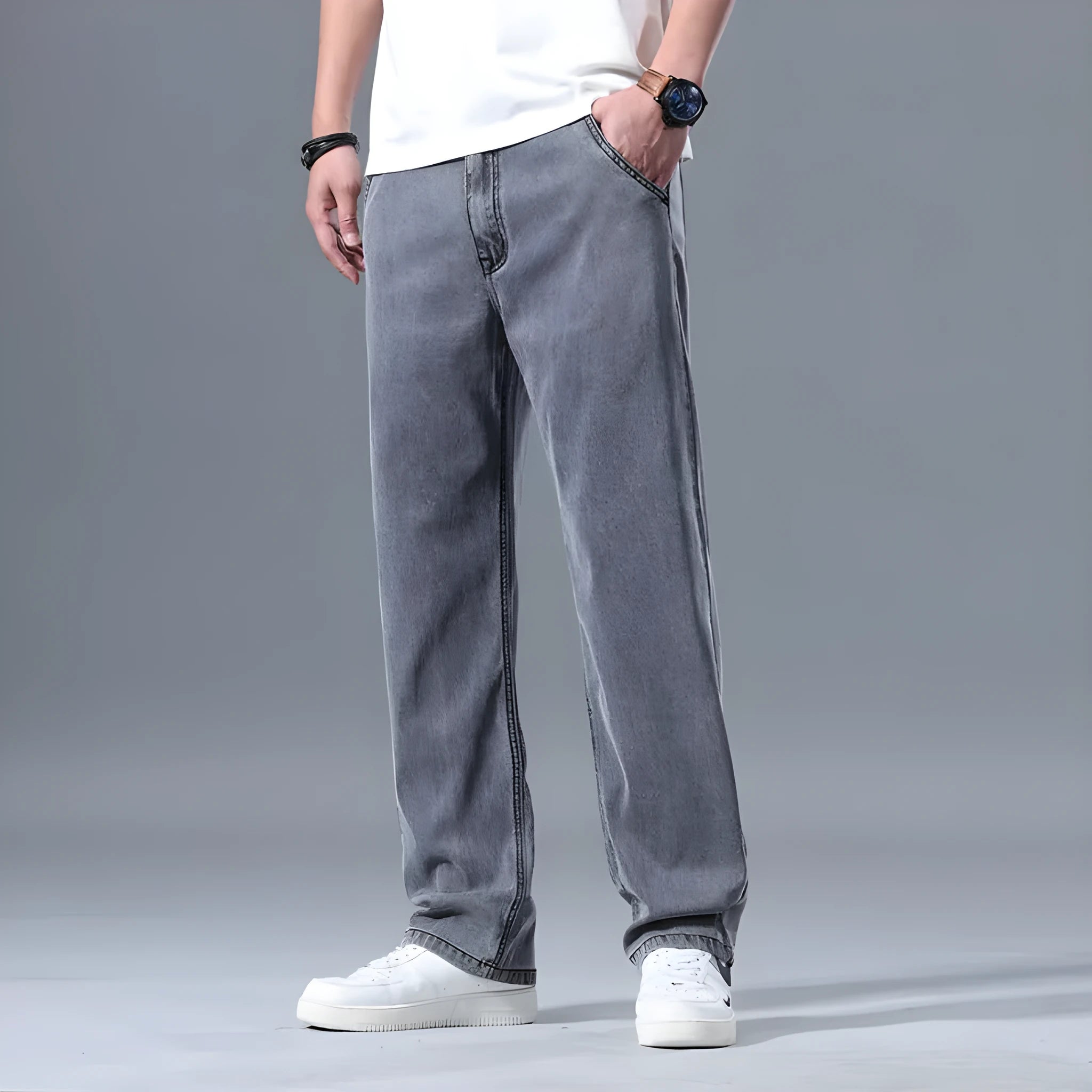 Men's loose fit straight-leg lyocell jeans in light blue colour with a zip fly.