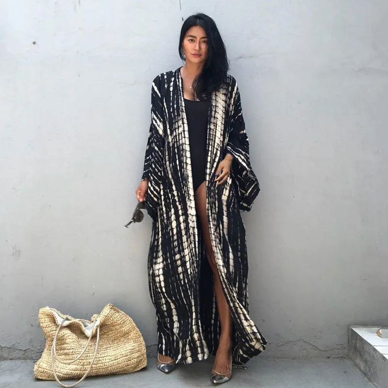 Woman wearing a printed cotton beach cover-up blouse in a DN0712 series colour.