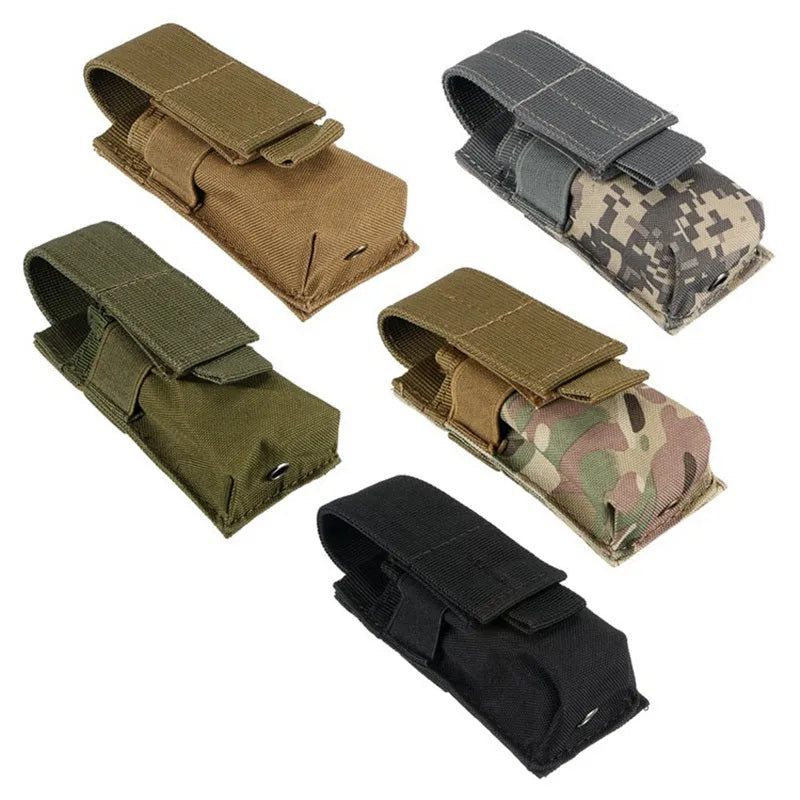 Black tactical molle waist bag for pistol cartridges or a small flashlight, showing elastic cord buckle.