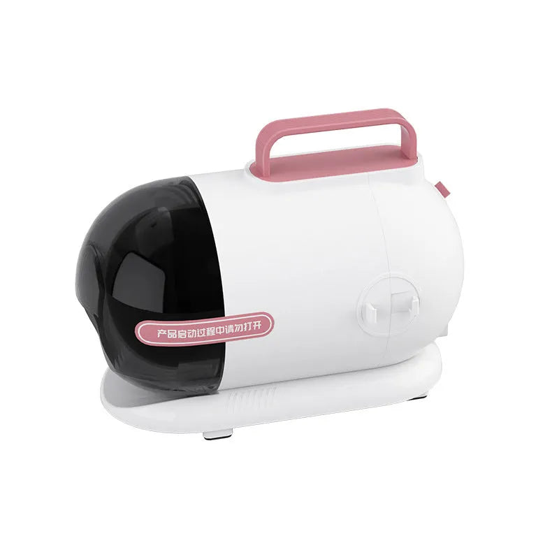 Pink and white pet grooming vacuum cleaner with hose, shear attachment, and grooming combs on a white background.