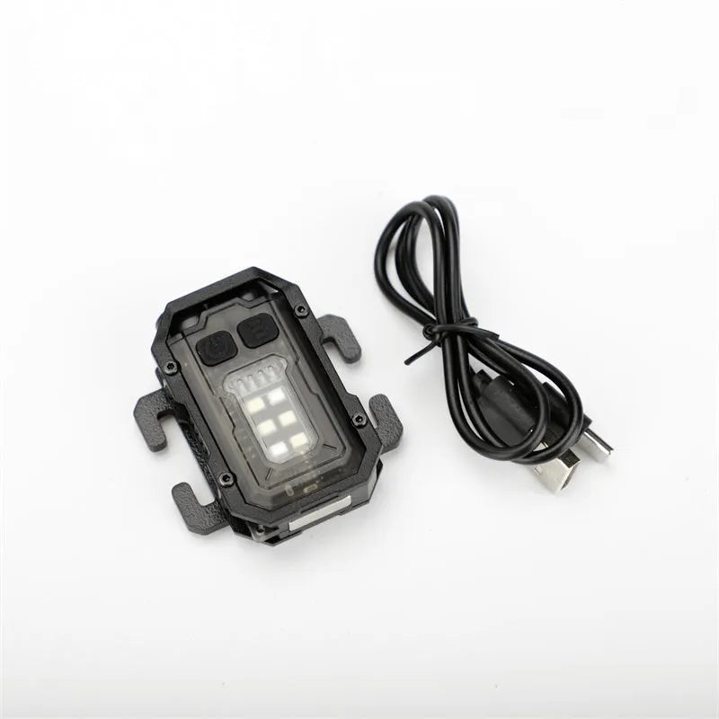 Portable tactical warning flashlight with USB charging cable for outdoor backpack mounting.