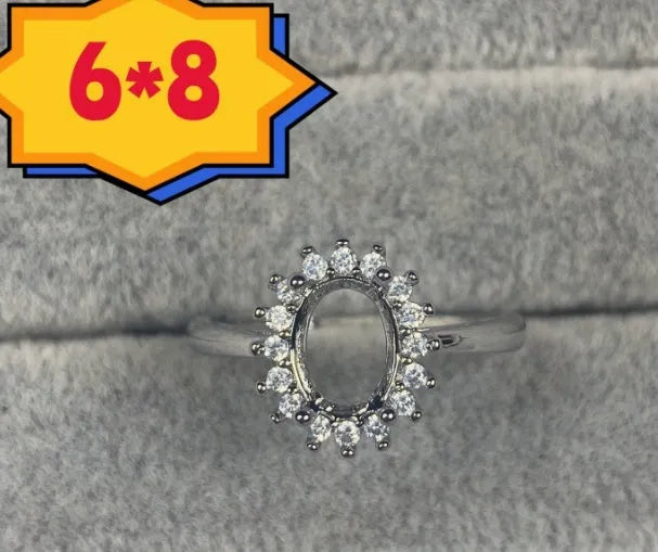 Oval denier ring with five-pointed star ornamentation and 6x8 mm main stone