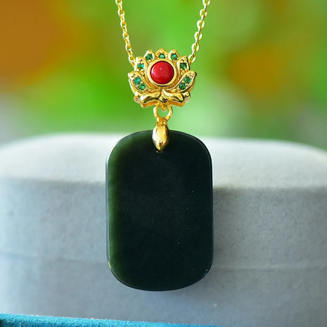 Flat minimalist pendant necklace made of ink blue Hetian grey jade with decorative copper inlay detail.
