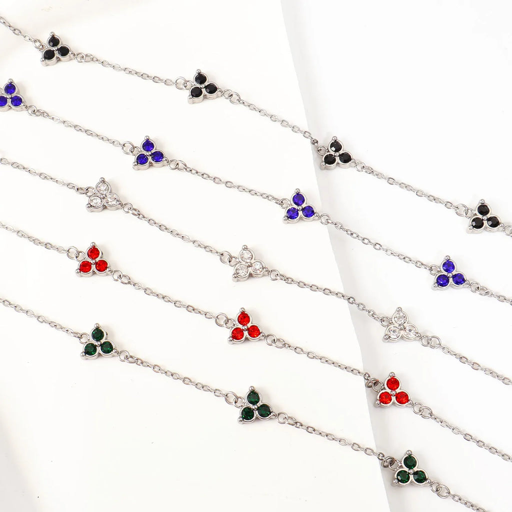 Stainless steel women's bracelet with three triangular diamond motifs set with colourful zircon stones.