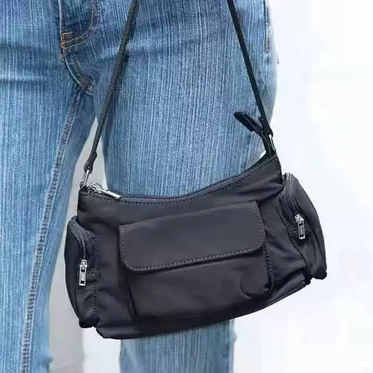 Black women's shoulder bag with side line detailing and double pockets