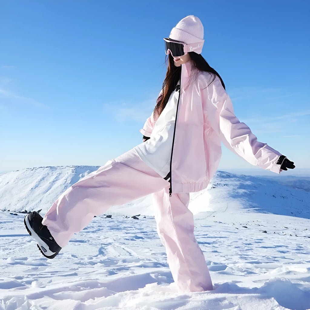 Winter outdoor waterproof ski suit set in black with jacket and trousers on snow