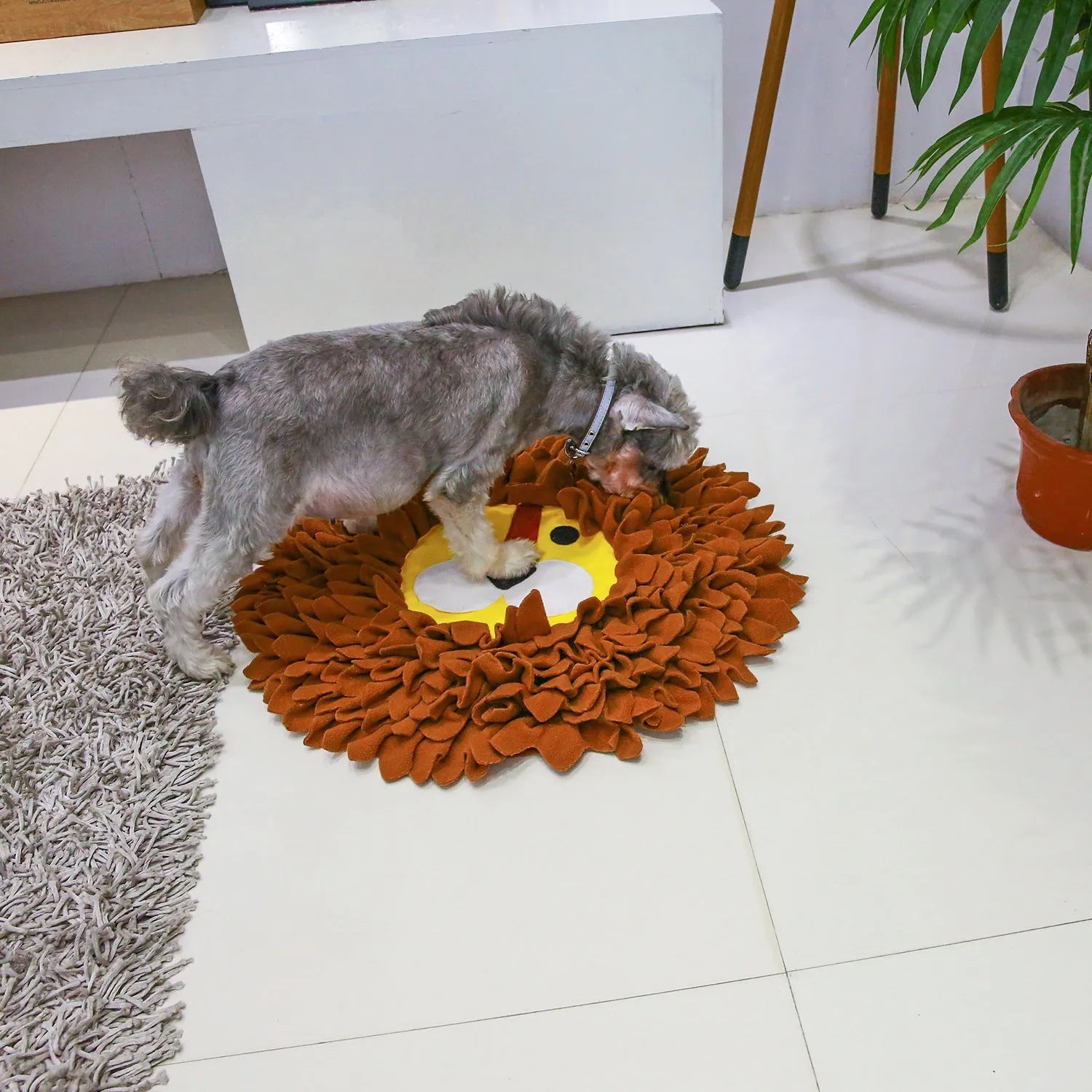 Brown lion-shaped pet sniffing pad with textured surface for treat hiding, 33 cm long
