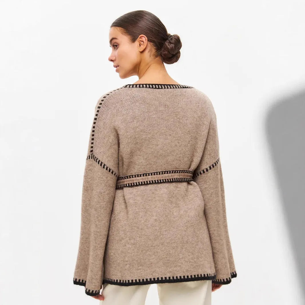 Lace-up front knitted cardigan in camel colour showing loose mid-length design and long sleeves
