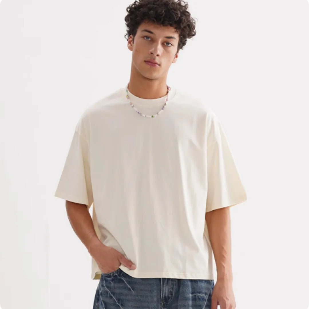 Men's loose fit pure cotton American style T-shirt in apricot colour on a hanger