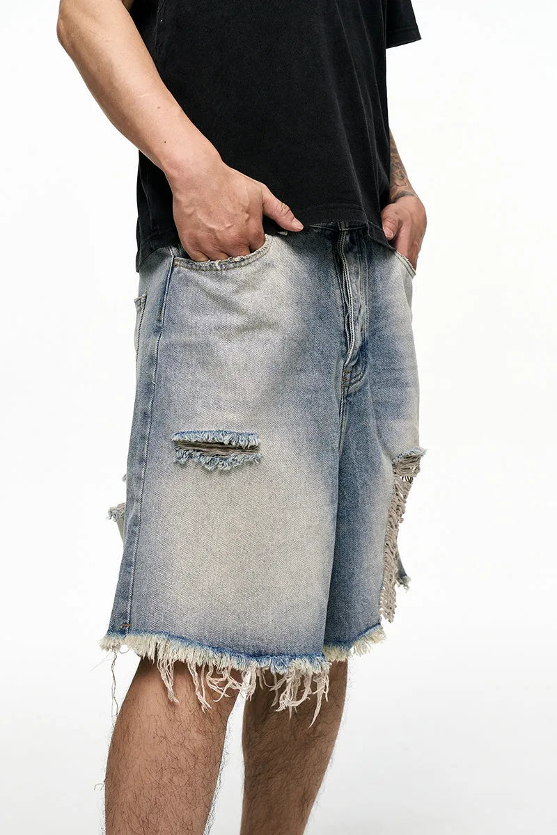 Light blue retro washed men's baggy denim shorts on a mid-waist model