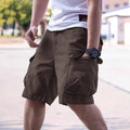 Men's loose fit cotton blend workwear shorts in army green with an elasticated waistband.