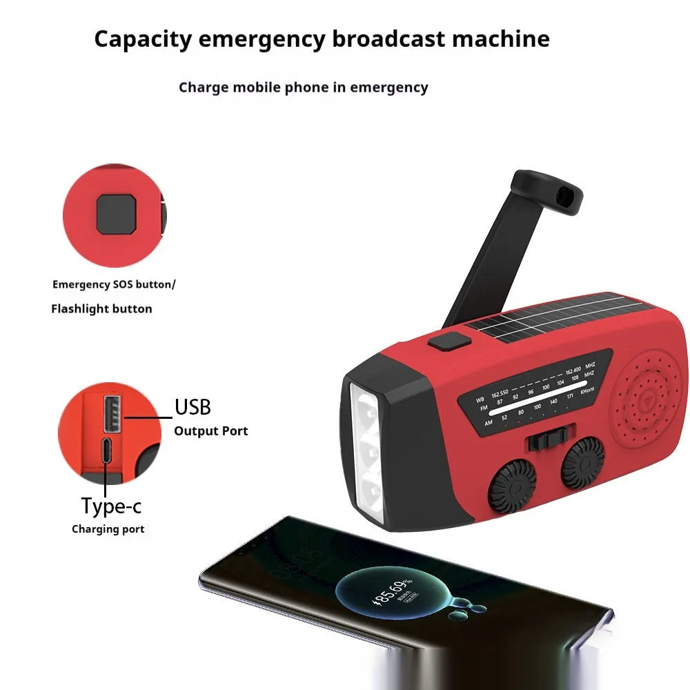 Red rechargeable hand torch radio with wrist strap, showing USB charging port and compact size.