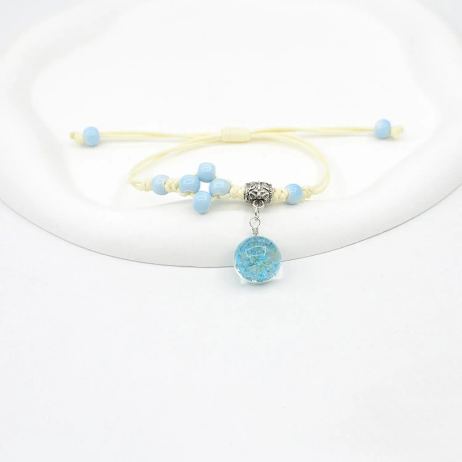 Glass dried flower bracelet with large 1.4cm beads containing real preserved flowers in hand-woven design